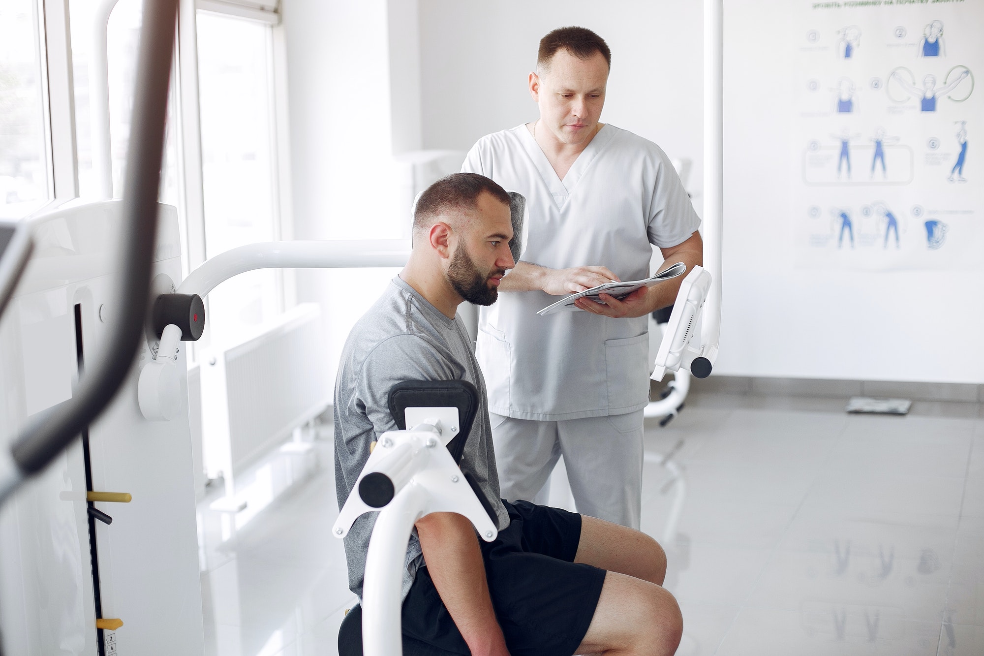 Doctor with a patient in physiotherapy clinic